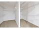 Spacious walk-in closet with carpeted floor and wire shelving for ample storage at 3844 Bowfin Trl, Kissimmee, FL 34746