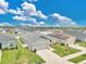 Aerial neighborhood view showcasing well-maintained homes and manicured lawns on a sunny day at 4270 Swan St, Haines City, FL 33844