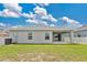 The backyard is lush and green with a covered patio, ideal for entertaining or relaxation at 4270 Swan St, Haines City, FL 33844