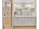 Bathroom featuring double sinks, tile flooring, and a shower with tile surround at 4270 Swan St, Haines City, FL 33844