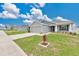 Charming single-story home featuring a well-maintained lawn, neutral color scheme, and a two-car garage at 4270 Swan St, Haines City, FL 33844