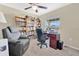 Cozy home office area with bookshelves, desk, and comfortable chair at 4270 Swan St, Haines City, FL 33844