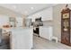 Bright eat-in kitchen featuring stainless steel appliances, white cabinets, and modern countertops at 4270 Swan St, Haines City, FL 33844