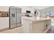 Modern kitchen featuring stainless steel appliances, white cabinets and countertops, and an island at 4270 Swan St, Haines City, FL 33844