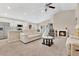 Spacious living room with neutral carpet, ceiling fan, a fireplace and an open floor plan at 4270 Swan St, Haines City, FL 33844