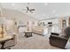 Open-concept living room with a ceiling fan, neutral walls, and comfortable seating at 4270 Swan St, Haines City, FL 33844