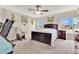 Light-filled main bedroom featuring a large bed, neutral walls, and carpeted floors at 4270 Swan St, Haines City, FL 33844