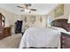 Bright main bedroom showcasing a large bed, dresser, and chair at 4270 Swan St, Haines City, FL 33844