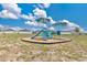 Community playground area featuring colorful slides and play structures, perfect for families at 4270 Swan St, Haines City, FL 33844