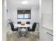 Bright dining area features a round marble table and modern black chairs, perfect for intimate meals at 530 E Central Blvd # 803, Orlando, FL 32801