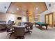 Comfortable game room with a pool table, seating, and bookshelves for leisure activities at 530 E Central Blvd # 803, Orlando, FL 32801