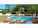 Beautiful outdoor pool with lounge chairs and lush landscaping, perfect for relaxation and enjoyment at 530 E Central Blvd # 803, Orlando, FL 32801