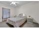 Cozy bedroom features soft lighting, neutral paint, and comfortable furnishings, creating a serene and inviting space at 670 Cotulla Dr, Kissimmee, FL 34758