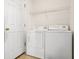 Functional laundry room with tile floors and a washer and dryer hook-up offers convenience and efficiency at 670 Cotulla Dr, Kissimmee, FL 34758