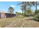 View of the spacious backyard with a screened-in patio, perfect for outdoor living and entertaining at 6700 Tamarind Cir, Orlando, FL 32819
