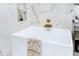 Modern bathroom featuring a soaking tub, elegant marble accents, and gold fixtures at 6700 Tamarind Cir, Orlando, FL 32819