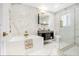 Modern bathroom with luxurious soaking tub, elegant marble tile, and frameless glass shower at 6700 Tamarind Cir, Orlando, FL 32819