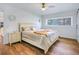 Bright bedroom featuring a cozy bed, a nightstand, and natural light from the window at 6700 Tamarind Cir, Orlando, FL 32819