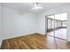 Inviting bedroom with wood-look floors, a ceiling fan, and sliding door to the lanai at 6700 Tamarind Cir, Orlando, FL 32819