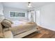 Serene bedroom with a comfortable bed, sliding closet door, and natural light from the window at 6700 Tamarind Cir, Orlando, FL 32819