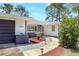 Inviting entrance featuring a curved stone walkway with landscaped details, and two-tone accents at 6700 Tamarind Cir, Orlando, FL 32819