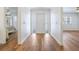 Inviting entryway with decorative front door, neutral walls, and views into other rooms at 6700 Tamarind Cir, Orlando, FL 32819