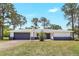 Charming single-story home featuring a gray roof, stylish two-tone paint, and a well-maintained front yard at 6700 Tamarind Cir, Orlando, FL 32819