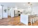 Modern kitchen featuring bright white cabinetry, stainless steel appliances, and a stylish island with bar seating at 6700 Tamarind Cir, Orlando, FL 32819