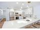 Bright kitchen featuring white cabinets, stainless steel appliances, and an island with pendant lighting at 6700 Tamarind Cir, Orlando, FL 32819