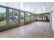 Relaxing sunroom with tile floors and multiple screened windows at 6700 Tamarind Cir, Orlando, FL 32819
