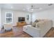 Comfortable living room with plush sectional sofa, accent chair, and large windows providing natural light at 6700 Tamarind Cir, Orlando, FL 32819