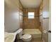 Bathroom features tiled walls and a shower over tub at 703 Tartan Loop, Lake Wales, FL 33853