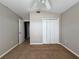 Bedroom featuring carpeted floor, closet and vaulted ceilings at 703 Tartan Loop, Lake Wales, FL 33853
