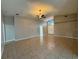 Open concept living room with tile flooring, neutral paint, and a ceiling fan at 703 Tartan Loop, Lake Wales, FL 33853