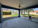 Covered patio offering ample space and views of the fenced backyard, ideal for relaxing or entertaining at 703 Tartan Loop, Lake Wales, FL 33853