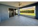 Spacious patio with access to the backyard and indoor area through sliding doors, perfect for gatherings at 703 Tartan Loop, Lake Wales, FL 33853