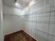 Walk-in closet with built-in shelving and carpeted floor at 703 Tartan Loop, Lake Wales, FL 33853