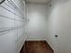 Walk-in closet with built-in shelving and carpeted floor at 703 Tartan Loop, Lake Wales, FL 33853