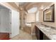 Bathroom with a tub, step-up platform, vanity, and shower for a soothing retreat at 7699 Milano Dr, Orlando, FL 32835