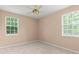 Neutral carpeted bedroom with natural lighting at 7699 Milano Dr, Orlando, FL 32835