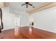 Spacious bedroom showcasing gleaming hardwood floors, large windows, and neutral tones for a serene ambiance at 7699 Milano Dr, Orlando, FL 32835