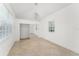 Bright bedroom featuring tile floors, a modern chandelier, and a mirrored closet at 7699 Milano Dr, Orlando, FL 32835
