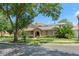 Beautiful home with lush landscaping, screened pool, and tile roof at 7699 Milano Dr, Orlando, FL 32835