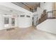 Spacious foyer with tile flooring, staircase, and double-door entrance for a grand welcome at 7699 Milano Dr, Orlando, FL 32835