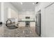 Kitchen featuring granite countertops, stainless steel appliances, and ample cabinet space at 7699 Milano Dr, Orlando, FL 32835