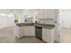 Bright kitchen with granite countertops, stainless steel appliances, and breakfast bar at 7699 Milano Dr, Orlando, FL 32835