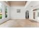 Bright living room features high ceilings, arched entry, and large windows for ample natural light at 7699 Milano Dr, Orlando, FL 32835