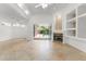 Open living area featuring a fireplace and sliding glass doors that lead to the patio and pool at 7699 Milano Dr, Orlando, FL 32835