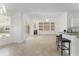 Open concept living room with fireplace, built-in shelves, and access to the outdoor living space at 7699 Milano Dr, Orlando, FL 32835