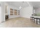 Bright living room with a fireplace, built-in shelving, and tile flooring at 7699 Milano Dr, Orlando, FL 32835
